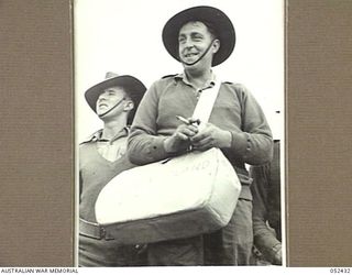 HERBERTON, QLD. 1943-06-12. NX60477 PRIVATE H. KINGSLAND, A BOOKMAKER AT THE 6TH AUSTRALIAN DIVISION RACE MEETING