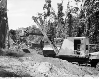 REINHOLD HIGHWAY, NEW GUINEA, 1943-09-03. MECHANICAL SHOVEL WORKING AT THE 8 1/4 MILE POINT FROM BULLDOG