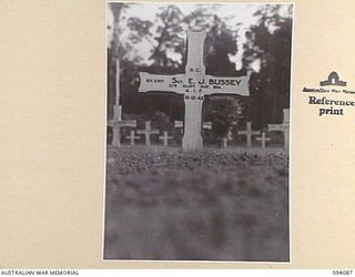 SOPUTA, NEW GUINEA, 1945-06-26. THE GRAVE OF SGT E.J. BUSSEY, 2/9 INFANTRY BATTALION IN THE AUSTRALIAN WAR CEMETERY MAINTAINED BY THE AUSTRALIAN WAR GRAVES SERVICE. HE WAS KILLED DURING THE LANDING ..