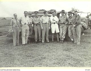 KOITAKI, NEW GUINEA. 1944-04-19. THE HONOURABLE E.J. WARD, MINISTER FOR EXTERNAL TERRITORIES IN THE AUSTRALIAN GOVERNMENT (5), WITH THE OFFICIAL PARTY DURING HIS VISIT TO A KOITAKI RUBBER ..