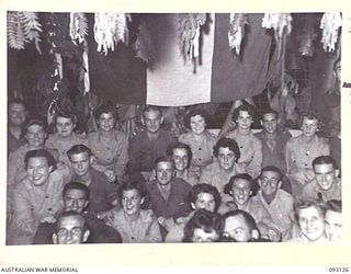 LAE AREA, NEW GUINEA, 1945-06-13. A GROUP PHOTOGRAPH OF GUESTS AND MESS MEMBERS AT A DINNER AND DANCE HELD BY NO. 2 OTHER RANKS' MESS, HQ FIRST ARMY
