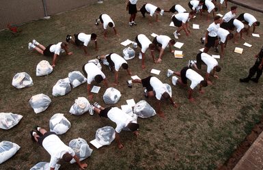 When 'push comes to shove' the Hawaii National Guard Youth Challenge staff resorts to push-ups as the disciplinary tool for punishing minor infractions to keep the new corps members in line during the five-month quasi-military residential phase. This federally funded program targets at-risk kids between 16 and 18 years old and tries to steer them away from trouble while they complete their high school requirements.(Published in AIRMAN Magazine May 1996 ) Exact Date Shot Unknown