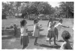 Children's game hiko juggling. (Looking towards fishing nets in back of Vai'uli's 'api.)