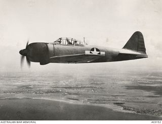 Japanese single engined fighter aircraft Mitsubishi A6M3 Zero in flight over Brisbane, Queensland.  The aeroplane was rebuilt at Eagle Farm (Brisbane) by Technical Air Intelligence Unit (combined ..