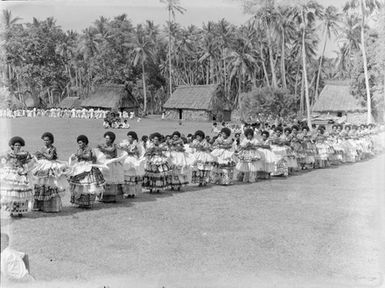 [Many women performing dance]