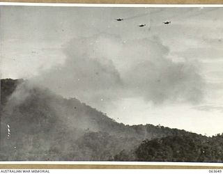 FARIA RIVER, NEW GUINEA. 1944-01-20. MTICHELL BOMBERS MOVING INTO ATTACK JAPANESE POSITIONS ACROSS MAIN CREEK