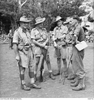 PAPUA. 1942-09. IN A FORWARD AREA ON THE TRACK TO KOKODA. LEFT TO RIGHT: BRIGADIER ARNOLD W. POTTS DSO MC (COMMANDING 21ST INFANTRY BRIGADE), CORPORAL RONALD SIMPSON (HIS DRIVER), WX3254 CAPTAIN ..