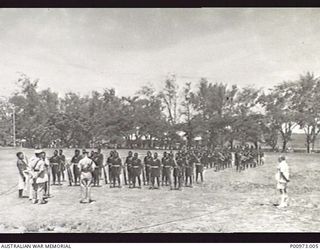 ELA BEACH, PORT MORESBY, PAPUA, 1953. NATIVE POLICE MEMBERS OF THE ROYAL PAPUA AND NEW GUINEA CONSTABULARY CORONATION CONTINGENT BEING INSPECTED BY THE ADMINISTRATOR SIR DONALD CLELAND