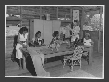 [Teacher trainees enjoy dressmaking classes at Popondetta Higher Education Centre,  New Guinea] Australian News and Information Bureau photograph by W. Brindle