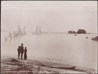 Three children on a beach near the native fishery of Siota, Florida, Solomon Islands, 1906 / J.W. Beattie