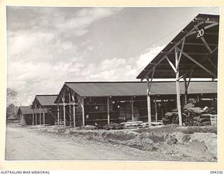 TOROKINA, BOUGAINVILLE. 1945-07-25. THE STORAGE SHEDS AT NO. 2 SUB DEPOT, 16 ADVANCED ORDNANCE DEPOT