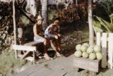 French Polynesia, people selling melons at roadside on Tahiti Island