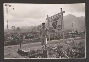 [Henry J. Cates Jr. Standing Beside Sign, #2]