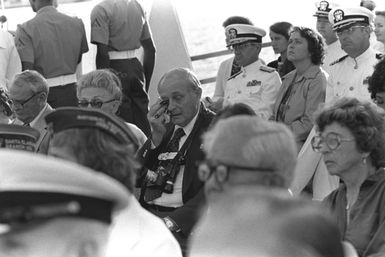 A guest wipes tears from his eyes during a memorial service aboard the USS ARIZONA Memorial commemorating the 40th anniversary of the Japanese attack on Pearl Harbor