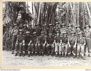 BOUGAINVILLE. 1945-04-03. BRIGADIER H.H. HAMMER, COMMANDER 15 INFANTRY BRIGADE (5), WITH BRIGADE STAFF OFFICERS AT HEADQUARTERS 15 INFANTRY BRIGADE. (FOR IDENTIFICATION OF 20 NAMED PERSONNEL REFER ..