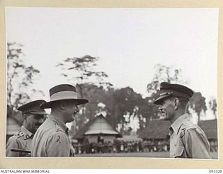 LAE AREA, NEW GUINEA, 1945-06-28. HIS ROYAL HIGHNESS, THE DUKE OF GLOUCESTER, GOVERNOR-GENERAL OF AUSTRALIA (2) TALKING TO MAJ-GEN B.M. MORRIS, GOC ANGAU (1) AND CAPT A.M. SINCLAIR, OFFICER- IN- ..