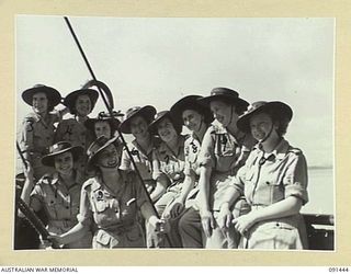 LAE, NEW GUINEA, 1945-05-07. A GROUP OF AUSTRALIAN WOMEN'S ARMY SERVICE ON THE RAIL OF THE MV DUNTROON BEFORE DISEMBARKATION. THEY ARE EN ROUTE TO THE AUSTRALIAN WOMEN'S ARMY SERVICE BARRACKS AT ..