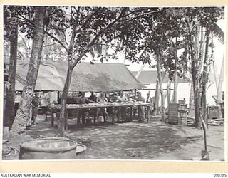 KERAVIA BAY, NEW BRITAIN. 1945-11-12. THE KITCHEN AREA AT THE ROYAL NETHERLANDS EAST INDIES ARMY CAMP, WHERE SOME 150 ROYAL NETHERLANDS EAST INDIES EX-PRISONERS OF WAR ARE AWAITING MOVEMENT TO ..