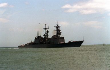 The destroyer USS ELLIOT (DD-967) approaches the entrance to the Pearl Harbor channel as it arrives for a visit to Naval Station, Pearl Harbor, Hawaii. The ELLIOT is en route to its home port of Naval Station, San Diego, Calif., after serving in the Persian Gulf region during Operation Desert Storm.