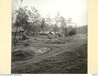 ZENAG, NEW GUINEA, 1944-02-28. COMMANDER ROYAL ENGINEERS HEADQUARTERS, (A.I.F.) WAU, AT THE SIXTY ONE AND A QUARTER MILE POINT ON THE WAU - LAE ROAD