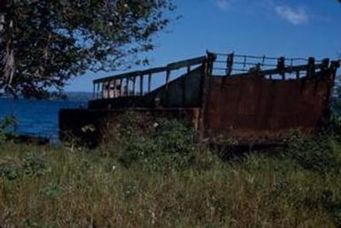 [Derelict metal boat ashore at Espiritu Santo, Vanuatu]