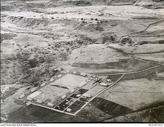 Garoka, New Guinea, 1945-11. Aerial view of the RAAF Aircrew Rest Camp known as 'Lamana', meaning 'Eternal Springs', which is located in the highlands at an altitude of 5,000 feet. The camp ..