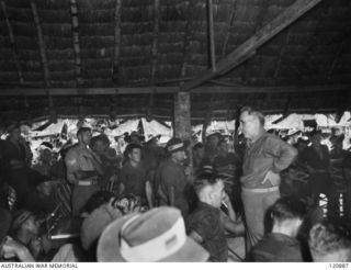 RABAUL, NEW BRITAIN. 1945-12-28. THE PRIME MINISTER OF AUSTRALIA, MR BEN CHIFLEY, ARRIVED BY PLANE TO VISIT MANY OF THE UNITS IN THE AREA. MR CHIFLEY TALKS TO TROOPS OF THE 11TH BATTALION IN THEIR ..