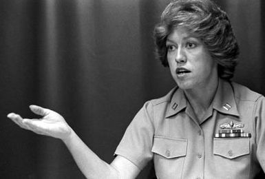 A candid shot of LT Billie Elizabeth Crawford, who is a Navy planning officer and the first woman both on board the USS JASON (AR-8) and in Pearl Harbor to become surface warfare qualified. She is now equally qualified to be officer-of-the-deck (OOD) underway and command duty officer (CDO) in port