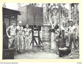 KALAI PLANTATION, NEW BRITAIN. 1945-03-07. A CRUDE LOOKING BUT VERY EFFECTIVE HOT WATER SYSTEM DESIGNED AND MADE BY VX147321 PRIVATE W.E. SLADE (1) FOR USE AT THE 6TH FIELD AMBULANCE