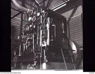 BOMANA, NEW GUINEA. 1943-11-08. ONE OF THE DIESEL ENGINES WHICH DRIVES THE PUMPS AT THE BOMANA PUMPING STATION. THIS UNIT SUPPLIES PORT MORESBY WITH 1,000,000 GALLONS OF WATER DAILY FROM THE LALOKI ..