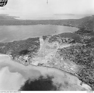 RABAUL, NEW BRITAIN. C. 1944. AERIAL VIEW OF LAKUNAI AERODROME LOOKING NORTH WEST