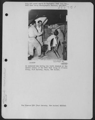 An Enlisted Man Having His Teeth Checked At The Dental Clinic Of The 38Th Bomb Group At 17-Mile Strip, Port Moresby, Papua, New Guinea. (U.S. Air Force Number 123750AC)