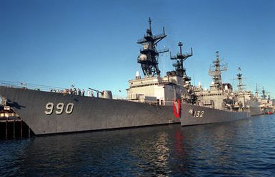 The Japanese Maritime Self-Defense Force destroyer ASAYUKI (DD-132) lies tied up alongside the destroyer USS INGERSOLL (DD-990).