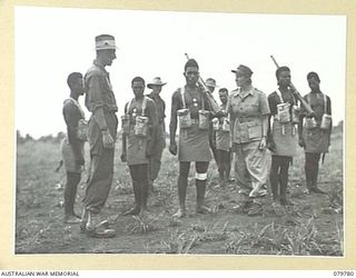 NADZAB, NEW GUINEA. 1944-12-05. MRS V. FISHER, BRITISH WAR CORRESPONDENT (1), INSPECTING TROOPS OF THE NEW GUINEA INFANTRY BATTALION DURING HER VISIT TO THE UNIT