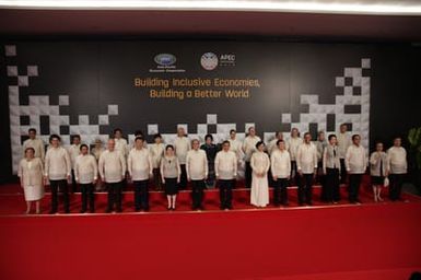 Barack Obama joins Asia Pacific Economic Cooperation Summit leaders and spouses for a group photo in Pasay, Metro Manila, Philippines, November 18, 2015