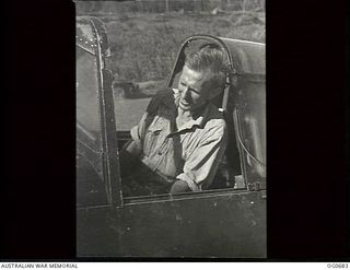 NADZAB, NEW GUINEA. C. 1944-02. SERGEANT C. J. MCFARLANE, COOPAROO, QLD, IN THE COCKPIT OF A VULTEE VENGEANCE DIVE BOMBER AIRCRAFT OF NO. 24 SQUADRON RAAF. AN ENGINEER, HE RUNS THE ENGINE UP FOR ..