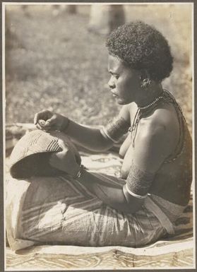 Girls Wanigella [Wanigela] village [seated woman with a pot] Frank Hurley