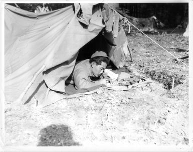 Nisei soldier writing a letter