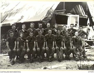 PERSONNEL OF NO. 6 PLATOON, HEADQUARTERS COMPANY, 27TH INFANTRY BATTALION IN FRONT OF THE REGIMENTAL "Q" STORE OF THE 23RD INFANTRY BRIGADE. IDENTIFIED PERSONNEL ARE:- SX39981 PRIVATE A.J. CAHILL ..