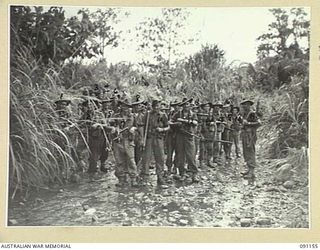 KARAWOP, AITAPE-WEWAK AREA, NEW GUINEA. 1945-04-22. A FIGHTING PATROL FROM C COMPANY, 2/1 INFANTRY BATTALION AT KARAWOP CREEK, THE STARTING POINT FOR A PATROL THROUGH ROUGH COUNTRY TO FIND AN ..