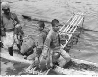 TINIAN, BOUGAINVILLE, 1945-07-18. JAPANESE PRISONERS OF WAR ABOUT TO BOARD THE ALLIED INTELLIGENCE BUREAU MOTOR LAUNCH ML1327, DURING THE RESCUE OF NETHERLANDS EAST INDIES PERSONNEL FROM THE EAST ..
