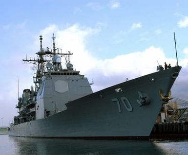 US Navy (USN) Ticonderoga Class Cruiser USS LAKE ERIE (CG 70) proudly displaying its golden anchor, sits pier side at Naval Station (NS) Pearl Harbor. The golden anchor symbolizes a high retention rate of shipboard personnel. The ERIE is participating in this year's Rim of the Pacific (RIMPAC) Exercise 2004. RIMPAC is an international exercise enhancing joint cooperation and proficiency of maritime and air forces of Pacific Rim nations