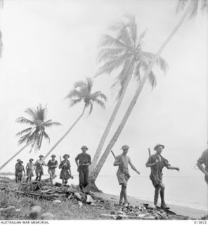 1942-12-11. PAPUA - GONA. PATROLLING TROOPS KEEP A WATCHFULL EYE ON THE COAST, CARE IS BEING TAKEN TO SEE THAT NO SUPPLIES GO THROUGH THE JAPANESE POCKETS IN THE GONA-BUNA AREA. (NEGATIVE BY G. ..