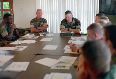 Lieutenant General J. D. Howell, Commanding General, Marine Forces Pacific, talks to officers of Marine Forces, about their involvement in the humanitarian effort during Operation PACIFIC HAVEN at Tiyan, Guam. PACIFIC HAVEN provided Kurdish evacuees political asylum from Iraq. While on Guam, the Kurds are provided shelter, food, clothing, medical care and assimilation classes for life in the United States