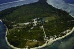 Aerial view of a mission station on an offshore island out from Wewak, Sepik district, Oct 1961