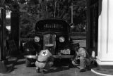 Guam, men servicing a car at a Texaco station