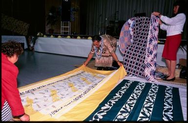 Women decorating chair for guest of honour at Niuean ear-piercing ceremony, Auckland