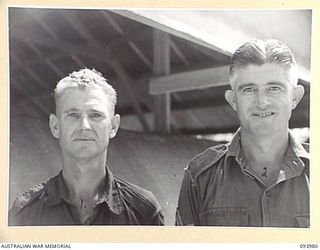 MALMAL VILLAGE, JACQUINOT BAY, NEW BRITAIN, 1945-07-15. WO 2 R. BOWYER (1), AND CPL A.L. BOURN (2), 33 FIELD SECURITY PERSONNEL AT HQ 5 DIVISION. THE MEN WERE PHOTOGRAPHED FOR SPECIAL PASSES
