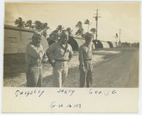 [Colonel Quigley, Jerry Michaud, and George at military base]