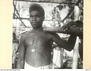 NEW GUINEA. 1944-06-29. A TYPICAL NATIVE LABOURER AT HEADQUARTERS NEW GUINEA FORCE